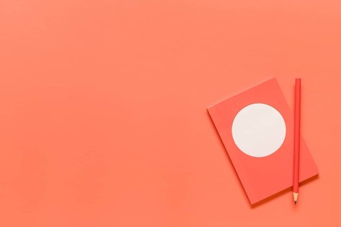 Composition pink notebook red pencil