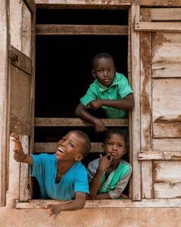 Medium shot african kids window