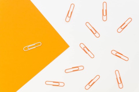 Collection paper clips with only white one
