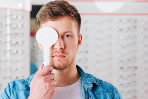 Portrait man doing test eye vision