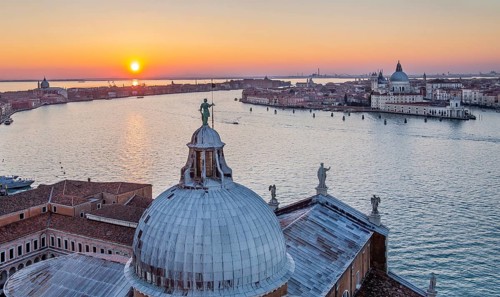 Sunset over the Giudecca Canal with the churches of San Giorgio Maggiore and Santa Maria della Salute