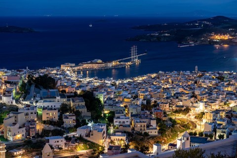 View of the illuminated town of Ermoupoli with harbour