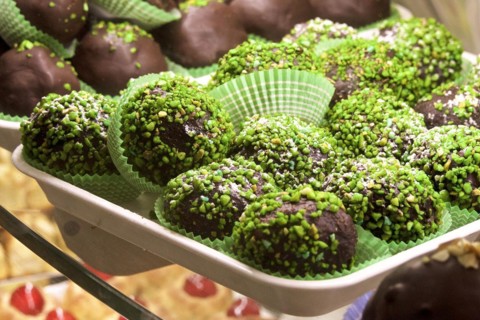 Chocolate biscuits with pistachios on tray