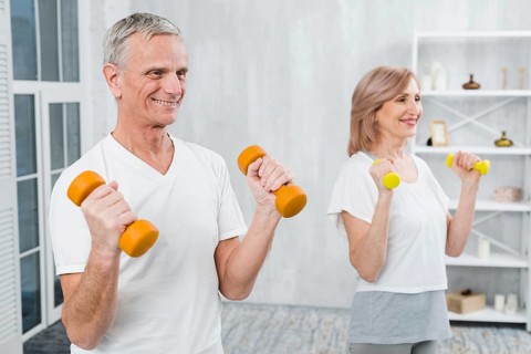 Joyful couple exercising home