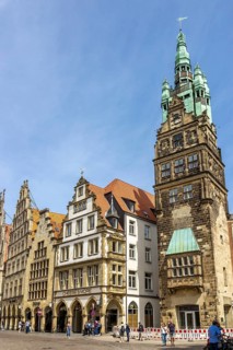 Town hall tower with gabled houses with archways on Prinzipalmarkt