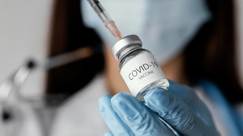 Doctor preparing covid 19 vaccine