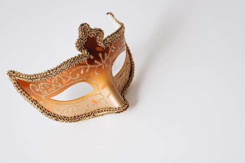 Orange carnival mask light table