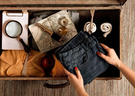 Top view individual packing vintage suitcase