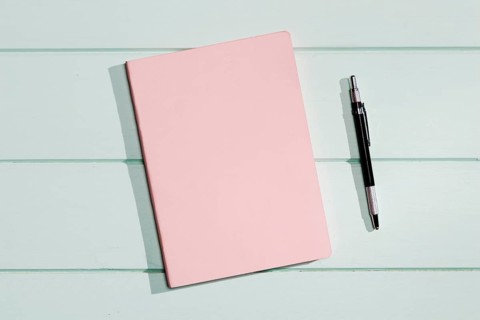 Pink cover notepad with pen