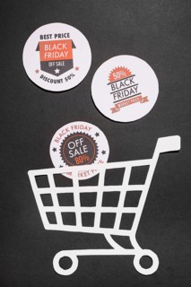 Labels with black friday offers paper shopping cart