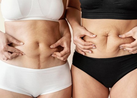 Close up women holding belly