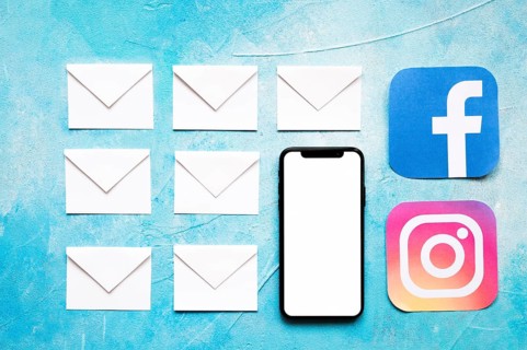 Paper white envelope messages social media icon with cellphone blue background