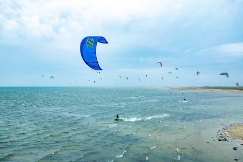 Kite surfers on the green beach of Terschelling