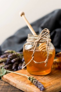 Honey jar with spoon lavender