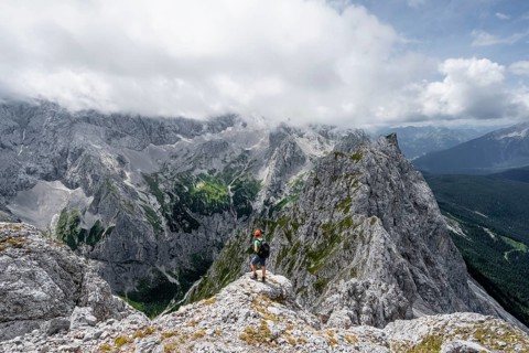 Mountaineer at the summit of the Waxenstein