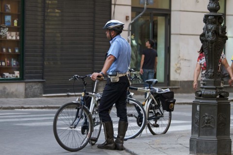 Policeman next to bicycle