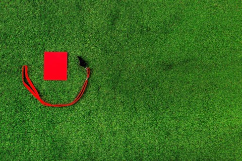 Football composition with copyspace red card