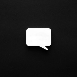 Dark surface with chat bubble