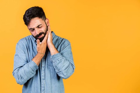 Medium shot guy with hands his chin
