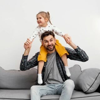 Medium shot father holding girl shoulders