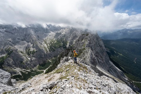 Mountaineer at the summit of the Waxenstein