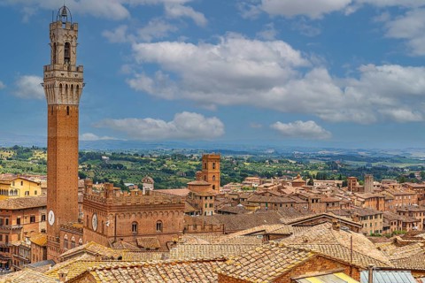 Above the rooftops of Siena with a view of the Torre del Mangia bell tower