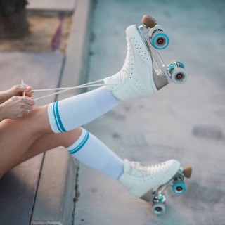 Low section woman tying lace roller skate road