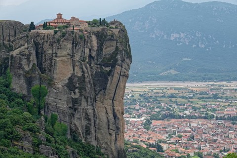 The Meteora Monastery Agia Triada Holy Trinity. The Greek Orthodox Meteora monasteries are built on sandstone cliffs above the Pinios valley. They are a UNESCO World Heritage Site. Kalambaka