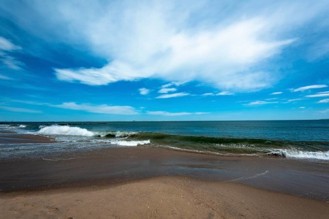 Listening to the ocean waves on a sunny spring day on the Brighton Beach