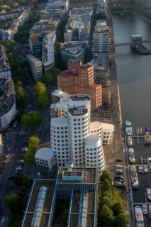 View from the Rhine Tower of the modern architecture of the Neuer Zollhof building and Gehry buildings next to the Duesseldorf Marina and the Media Harbour