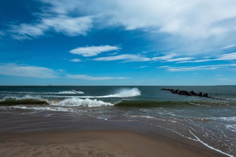 Listening to the ocean waves on a sunny spring day on the Brighton Beach
