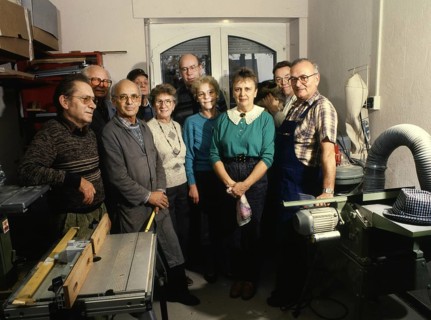 Group of pensioners produces toys for children. 80s