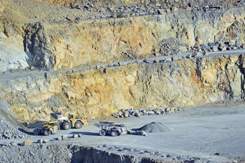 Trucks at work in porphyry quarry