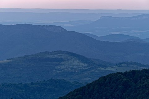 Evening mood over the mountain landscape of the Balkan Mountains and the forested slopes of the Balgarka nature park Park in Central Bulgaria. Shipka