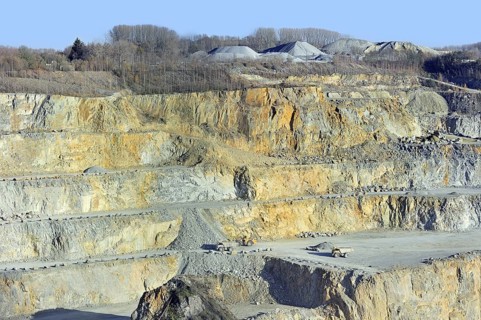 Trucks at work in porphyry quarry