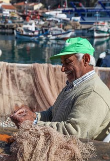 Fishermen mending nets in the Old Port of Antalya