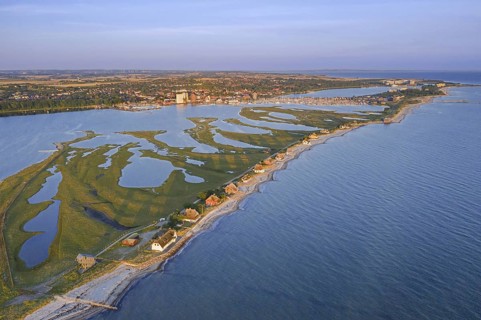 Aerial view over houses on the shore along the Baltic Sea coast at Steinwarder peninsula