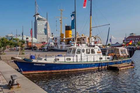 Historic ships in the New Harbour with the Atlantic Sail City Hotel