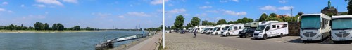 Panoramic photo of motorhome pitches on the banks of the Rhine