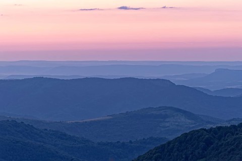 Evening mood over the mountain landscape of the Balkan Mountains and the forested slopes of the Balgarka nature park Park in Central Bulgaria. Shipka