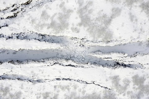 Aerial view over the Almannagja Canyon in the snow in winter