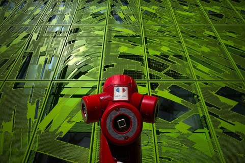 Red hydrant in front of Le Cube Verte