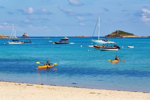 Kayakers and boats off the coast