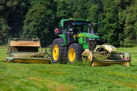 Grass mowing in a small field near Waldheim with a John Deere tractor