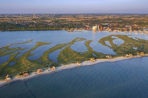 Aerial view over houses on the shore along the Baltic Sea coast at Steinwarder peninsula