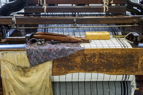 Wooden shuttles on mechanical flying shuttle loom