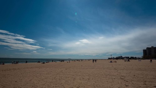 Listening to the ocean waves on a sunny spring day on the Brighton Beach