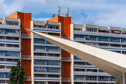 Residential building at Alexanderplatz with concrete spire from the foundation of the television tower