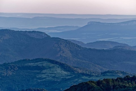 Daybreak over the mountain landscape of the Balkan Mountains and the forested slopes of the Balgarka nature park Park in Central Bulgaria. Shipka
