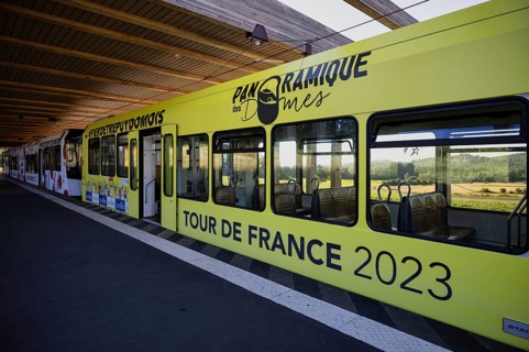 Bottom station of the Panoramique des Domes rack railway in Tour de France 2023 all-car advertising